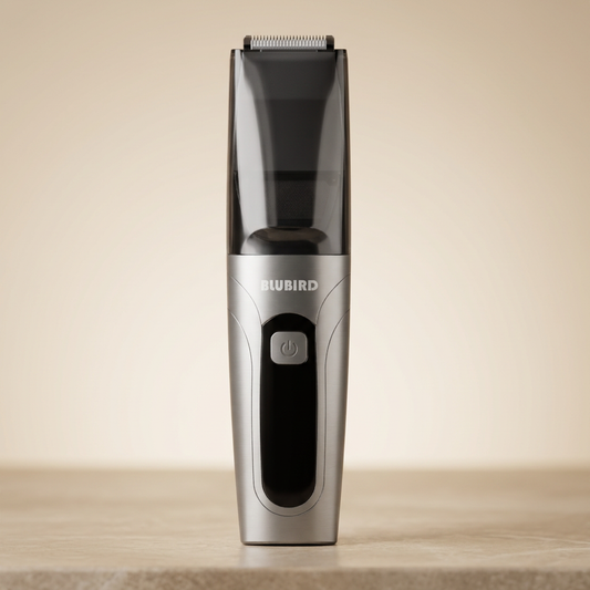 Blubird Suckaa vacuum-powered trimmer standing on a warm-neutral stone surface in soft editorial light, calm spa-like mood, BLUBIRD wordmark visible on the silver device body