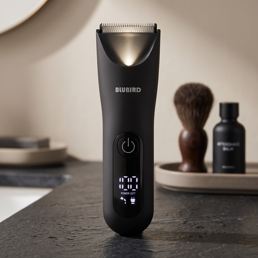 Trim reaper vs philips bodygroom, the Blubird Trim Reaper body trimmer on a dark slate bathroom counter in warm light